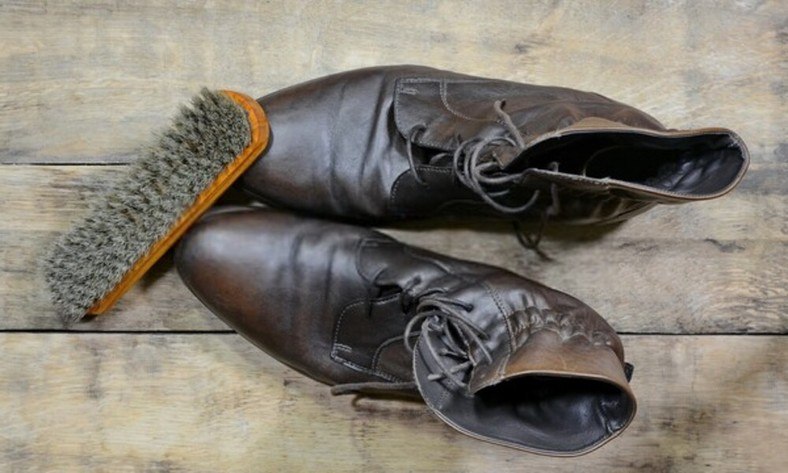 Leaning cowboy boots before polishing