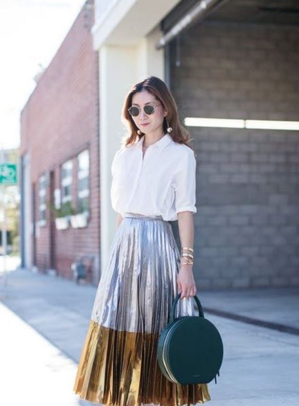 Combine mules with a light shirt and pleated skirt