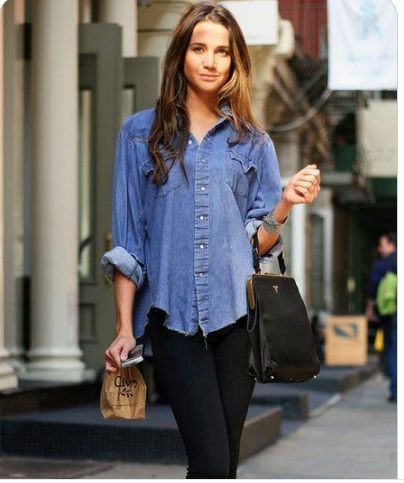 A navy chambray long sleeve shirt with black ripped jeans
