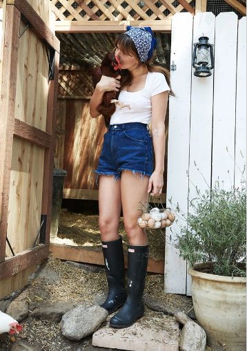 A Simple T-Shirt Compared With High Waisted Shorts And Rain Boots With A Bandana Headband