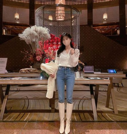 Silk Blouse, Skinny Jeans, And Knee-High Boots