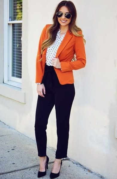 A White Polka Dot Shirt with an Orange Blazer and Black Pants