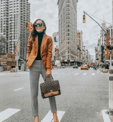 Black Turtleneck and Orange Blazer with Grey Trousers