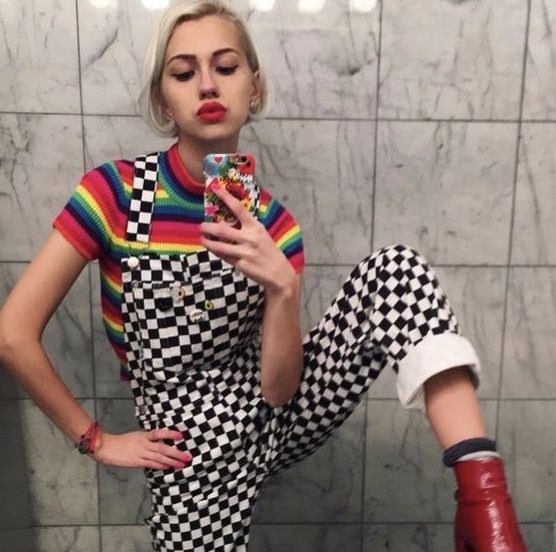A Rainbow T-Shirt With Checkerboard Overalls