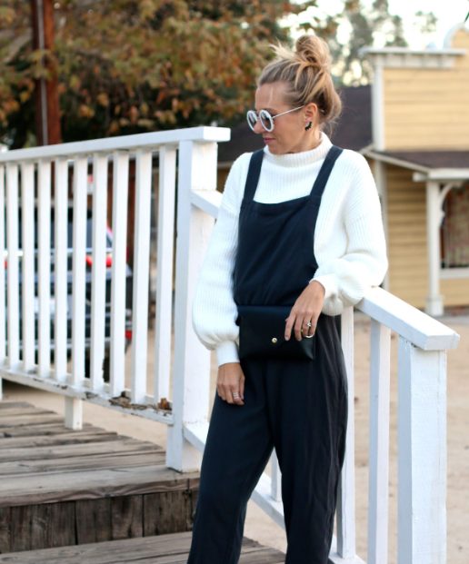 A White Sweater With Black Overalls