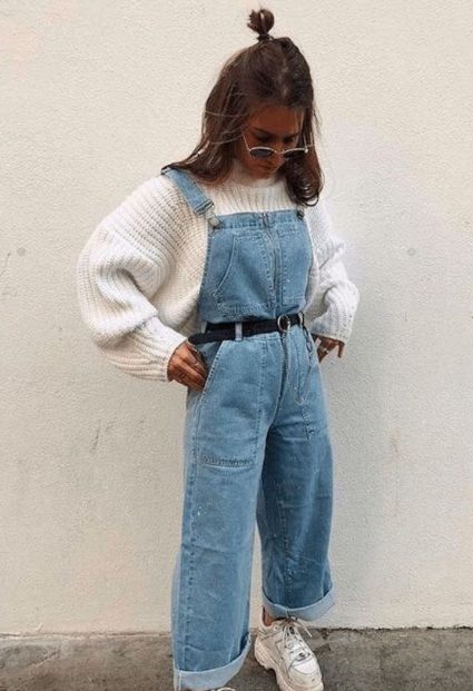 A White Knit Turtleneck Sweater With Light Blue Denim Overalls