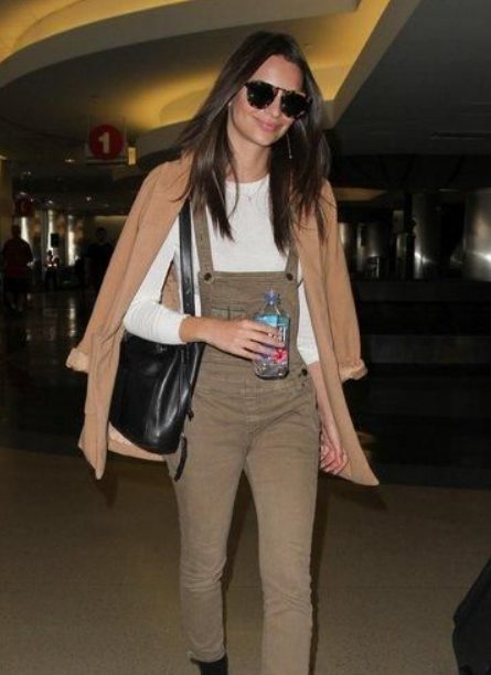 A White Sweatshirt And Beige Jacket With Brown Overalls