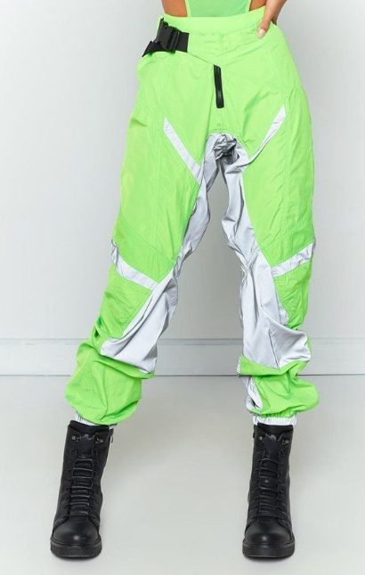 Green Joggers Paired With Black Bondage Boots