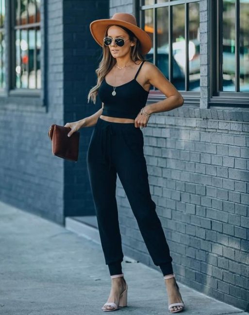 Heels With An Ankle Strap, A Black Tank Top, And Shades