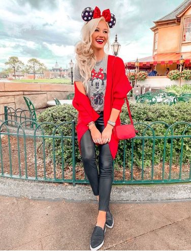 A Red Jacket And Leather Leggings