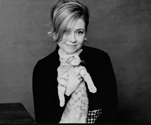Jenna Fischer with a cat in black and white photo