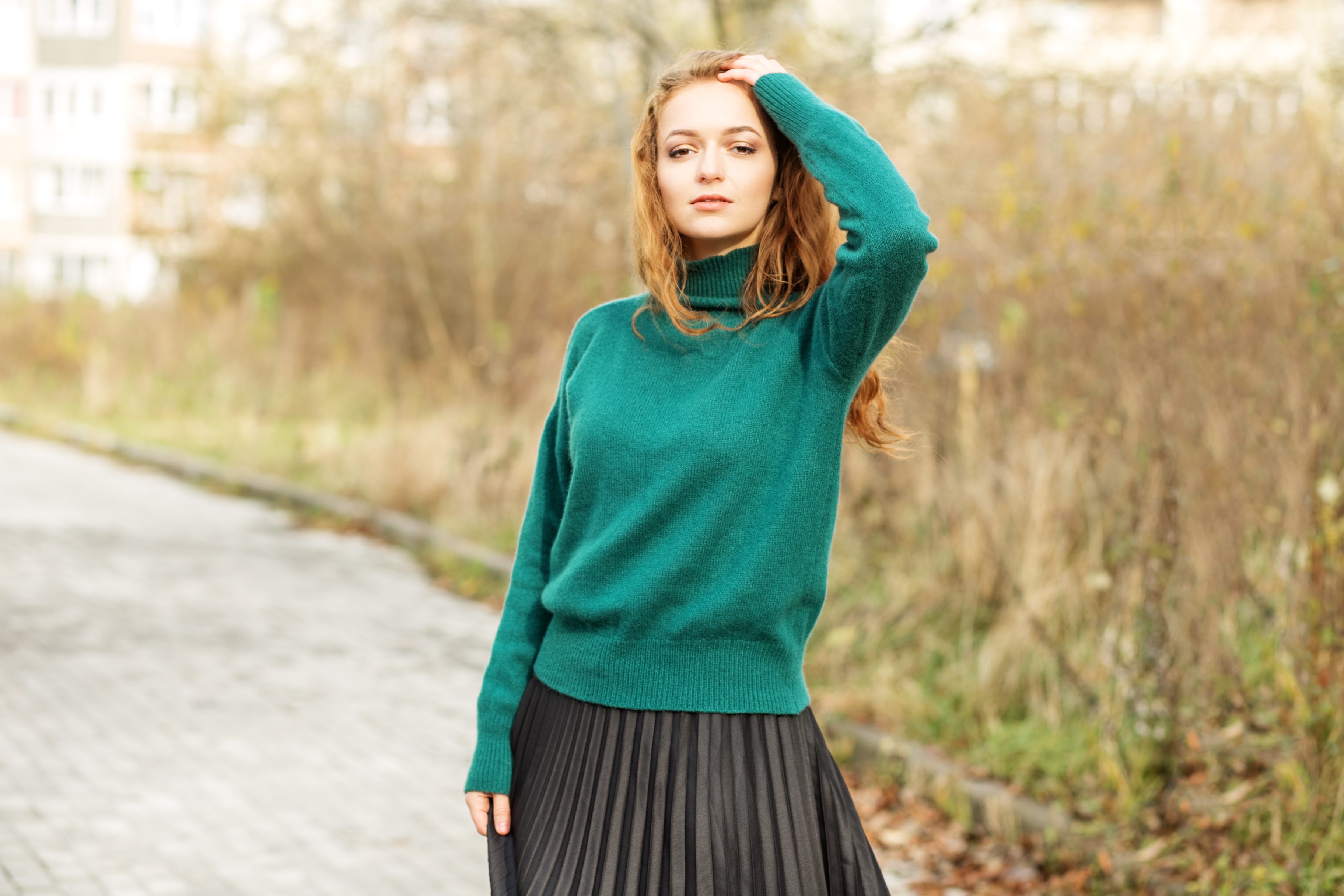 Light Green Sweater With A Pleated White Skirt