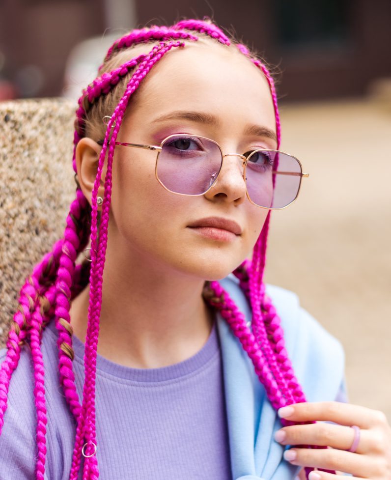 Braids In a Box With a Pink Strand