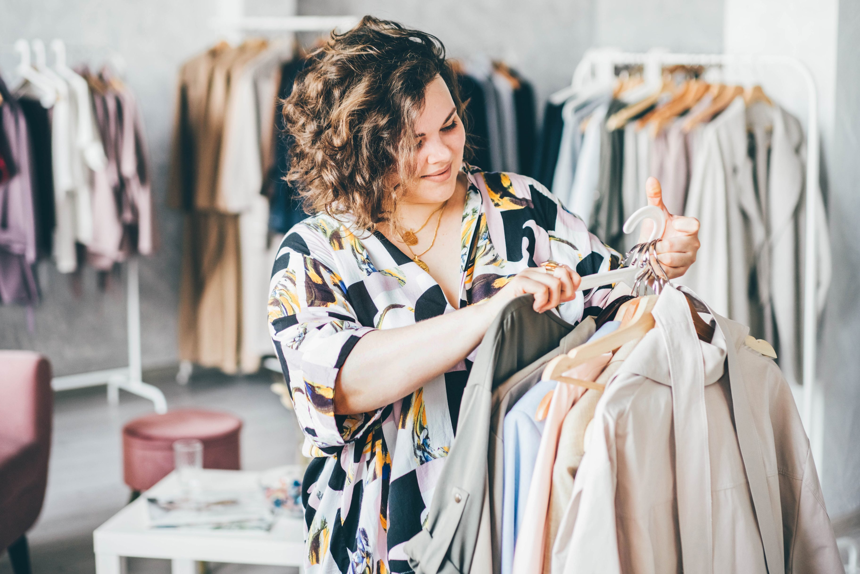 Plus Size Woman Picking Dresses in the Store