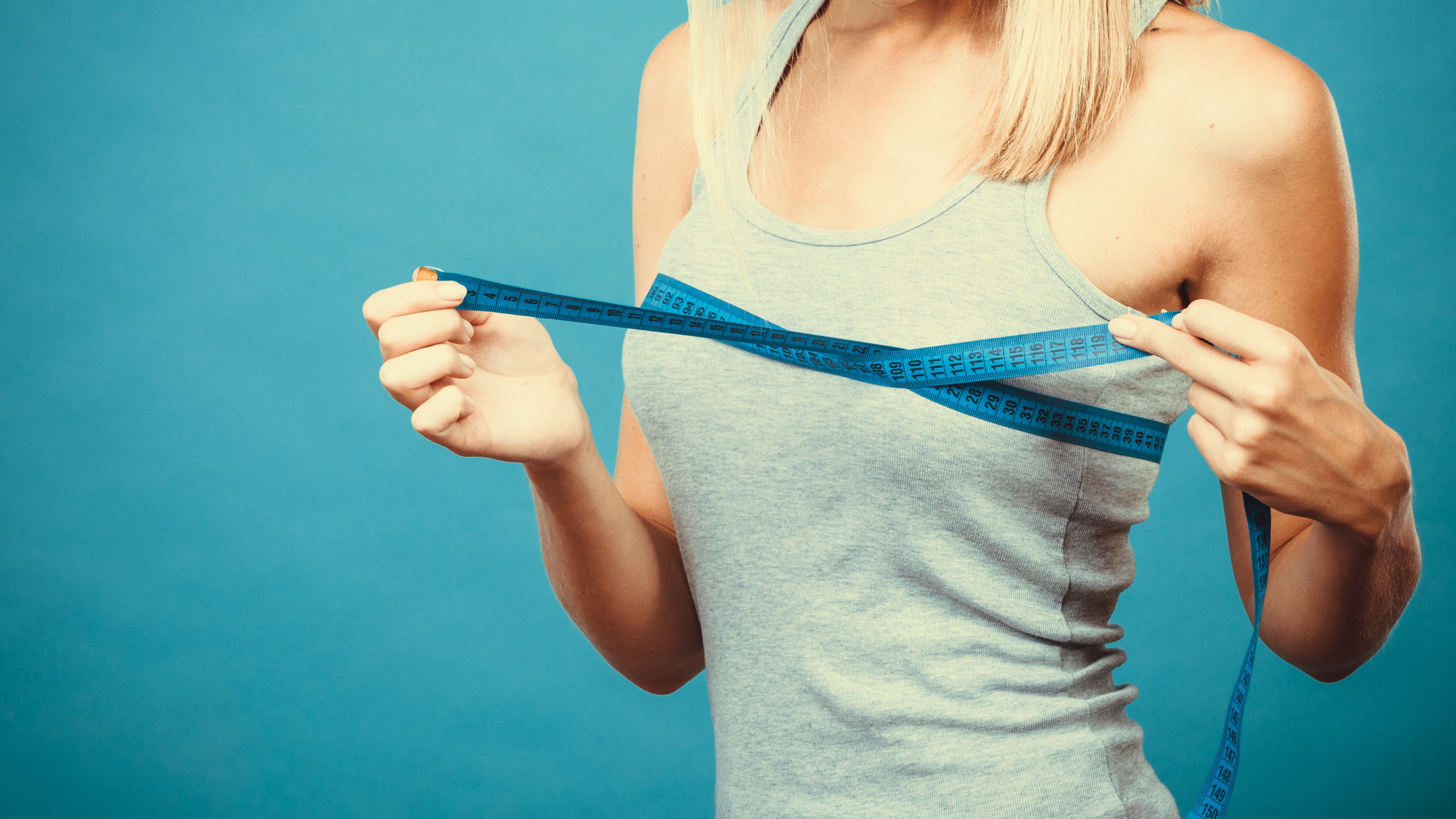 fitness women measure her chest size for bra decision