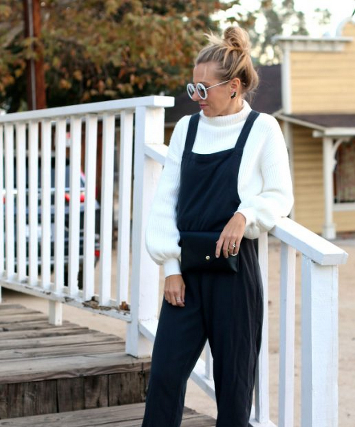 A White Sweater With Black Overalls