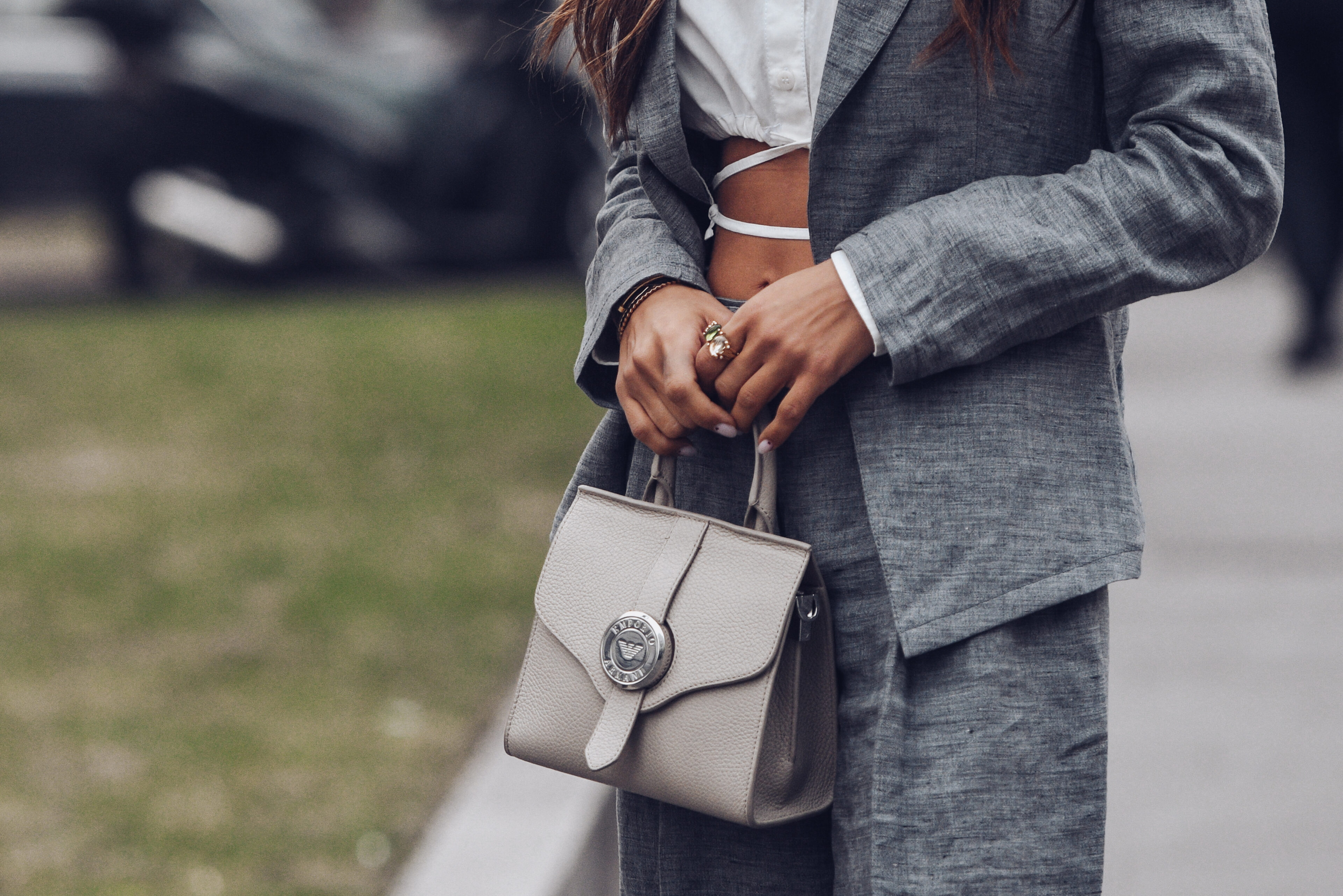 White Cropped Shirt + a Gray Blazer Jacket + a Beige Leather Handbag