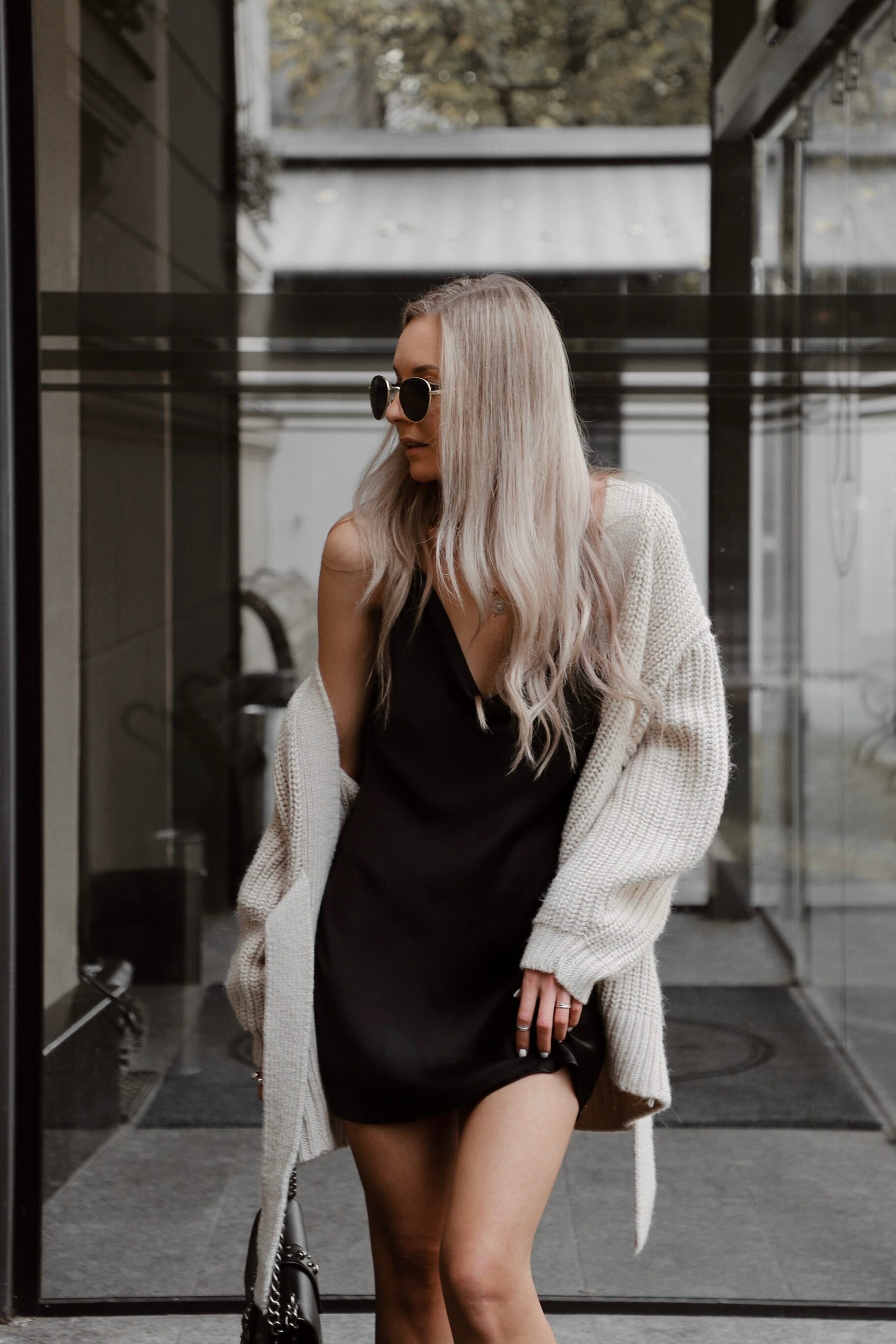 Black Mini Dress And Beige Knitted Oversized Cardigan
