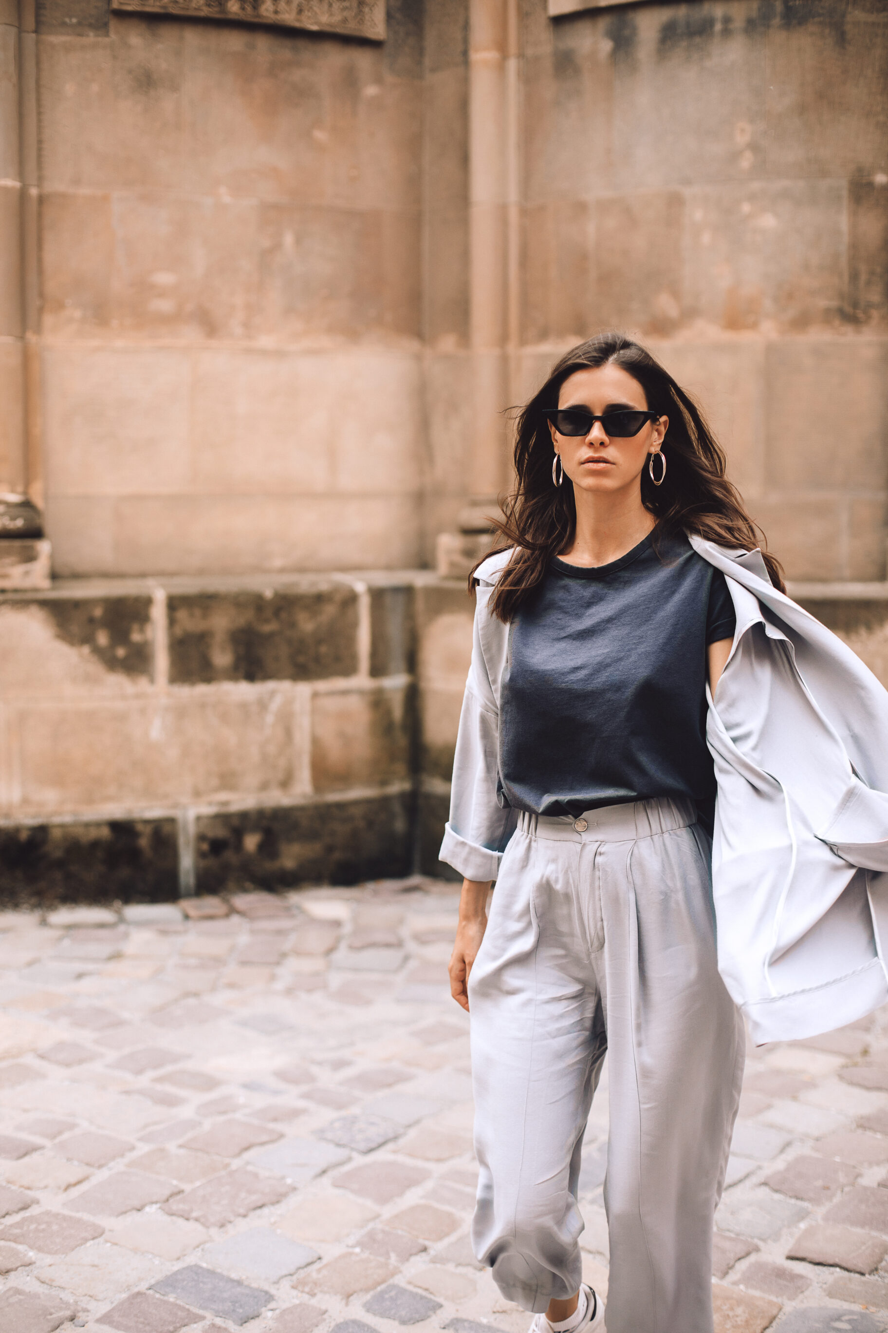 A T-Shirt, Jacket, And Gray Pants