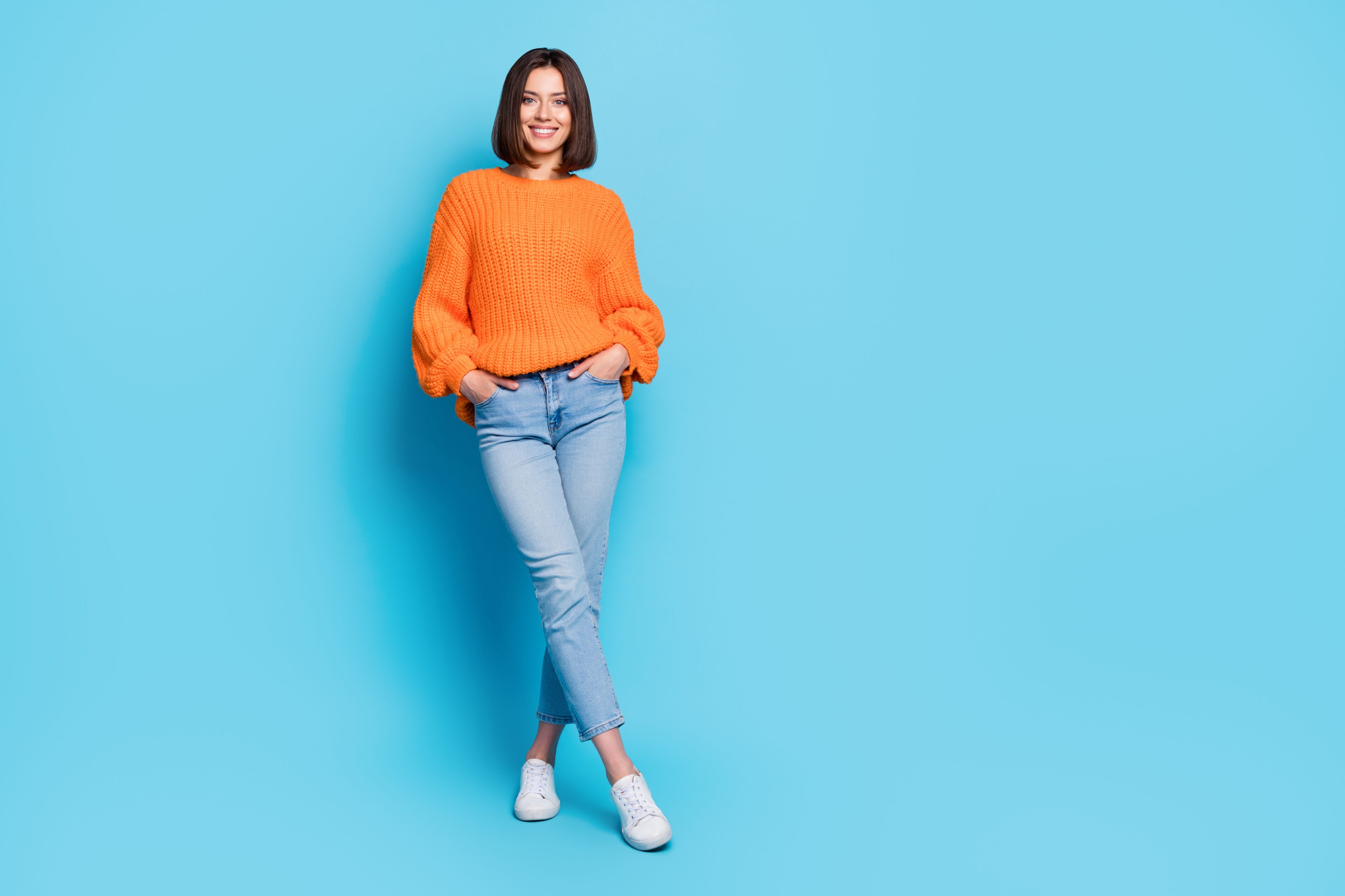 Orange Sweater And Light Blue Jeans