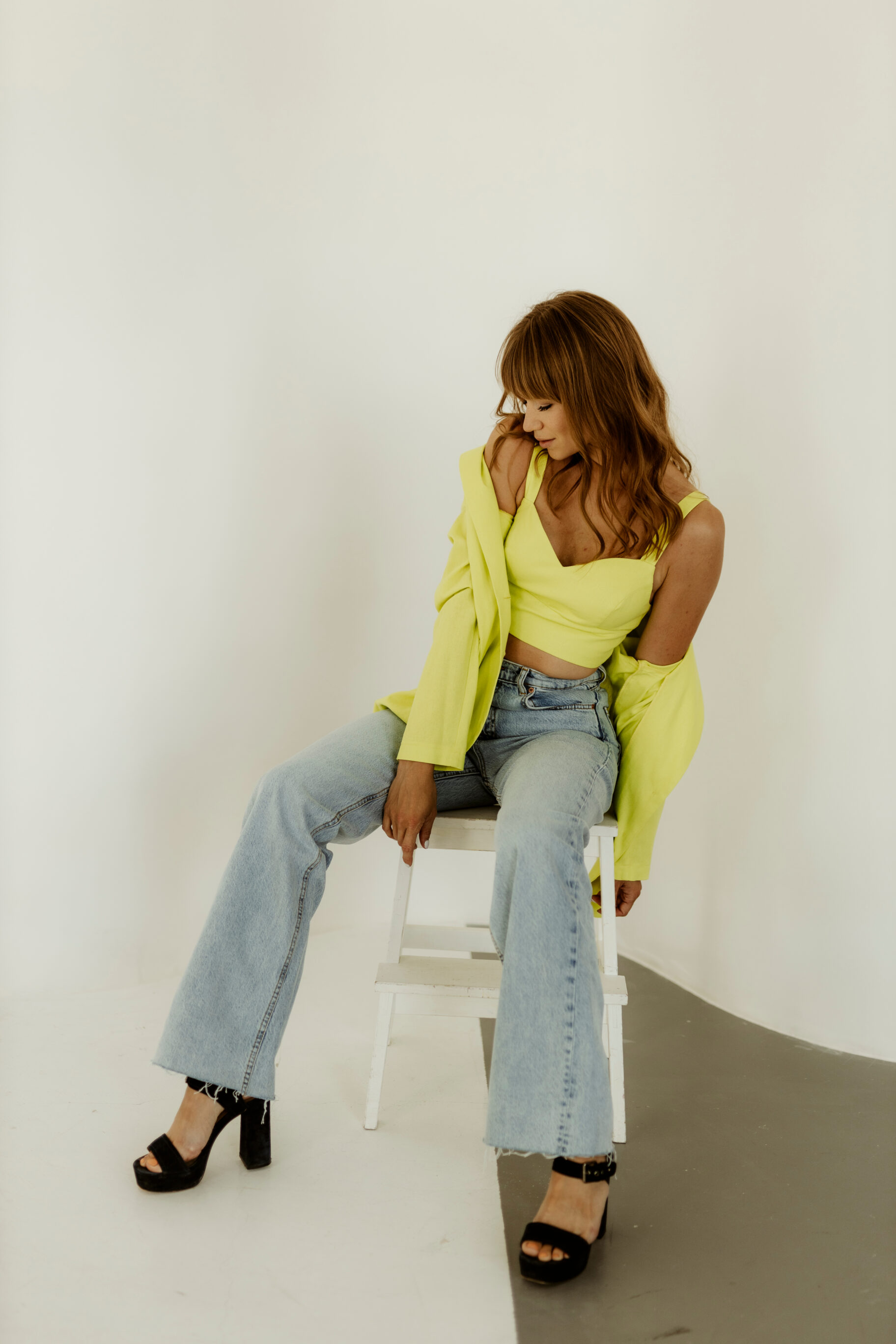 Bright Yellow Croptop, Jacket, and Light Blue Jeans