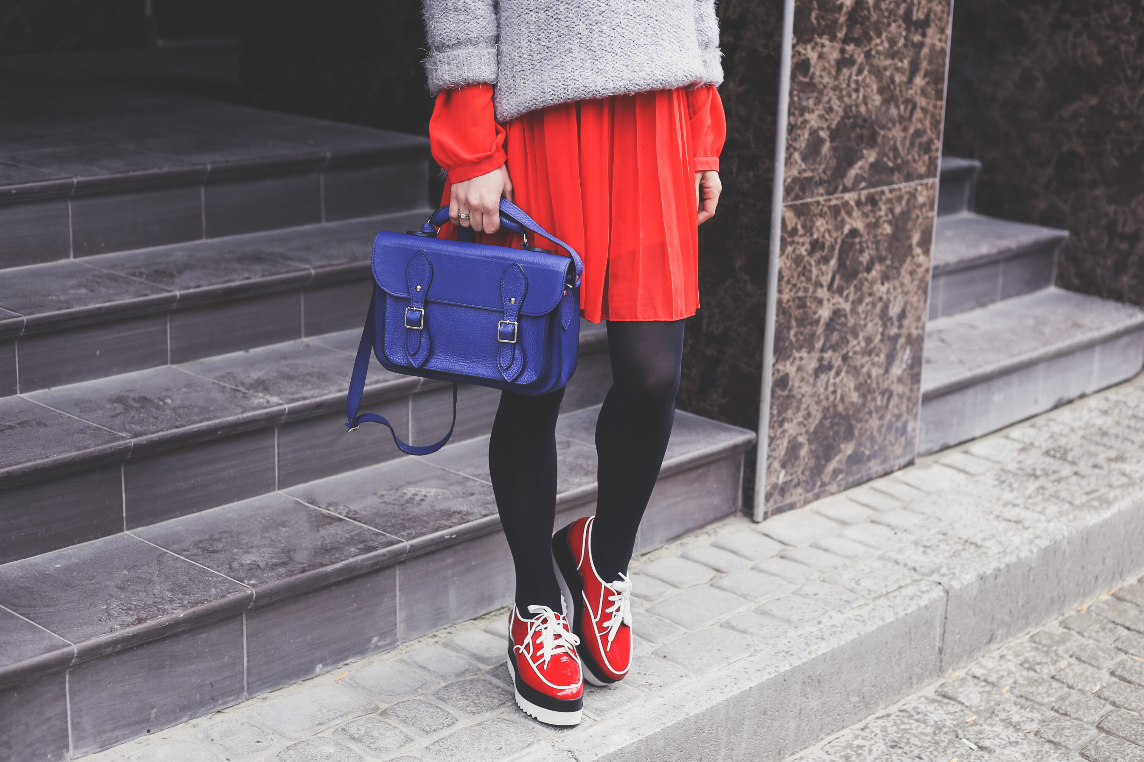 Gray Sweater, Red Pleated Skirt, Leggings, And Sneakers