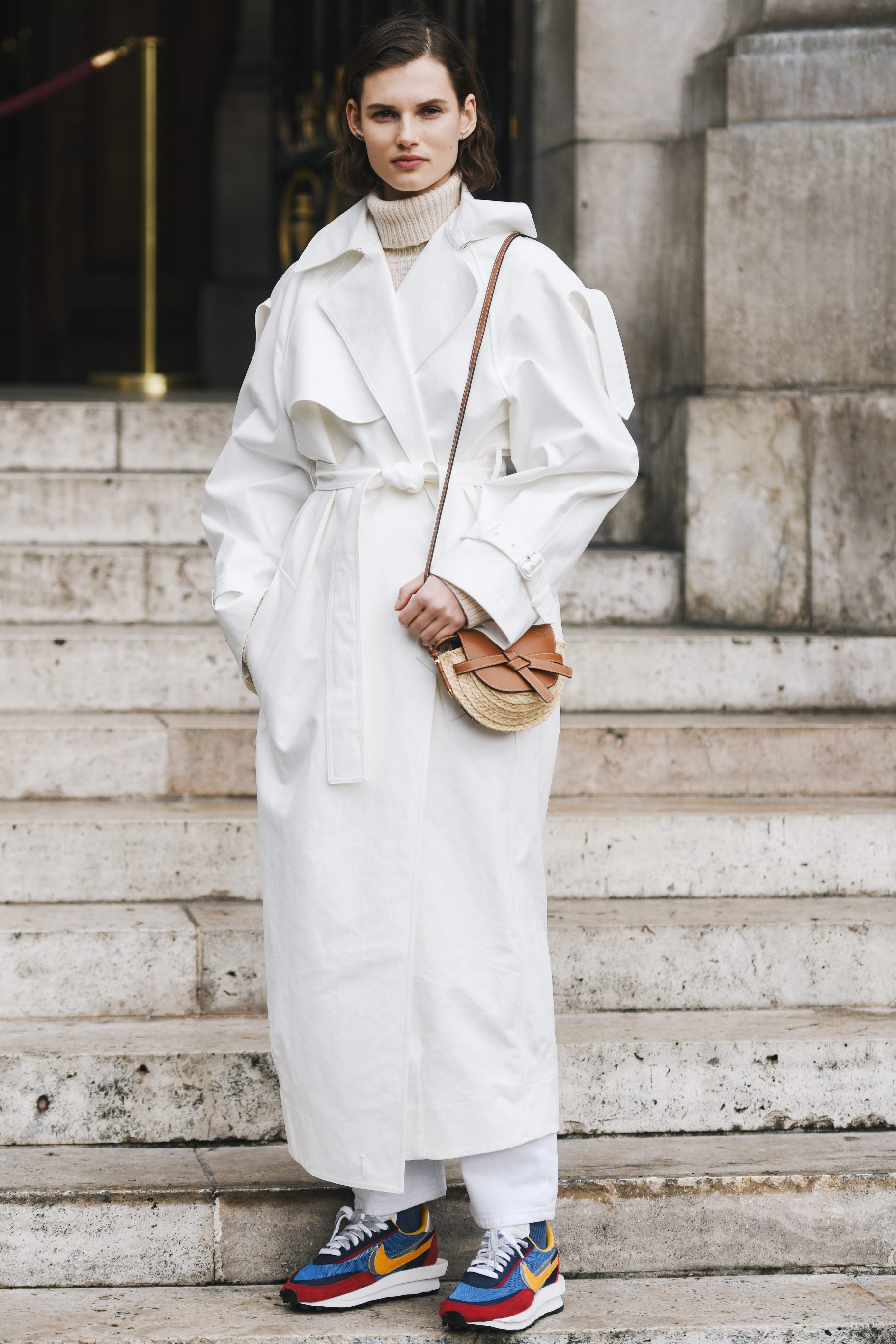 Gray Turtleneck Sweater, Long White Coat, White Pants, And Colorful Nike Shoes