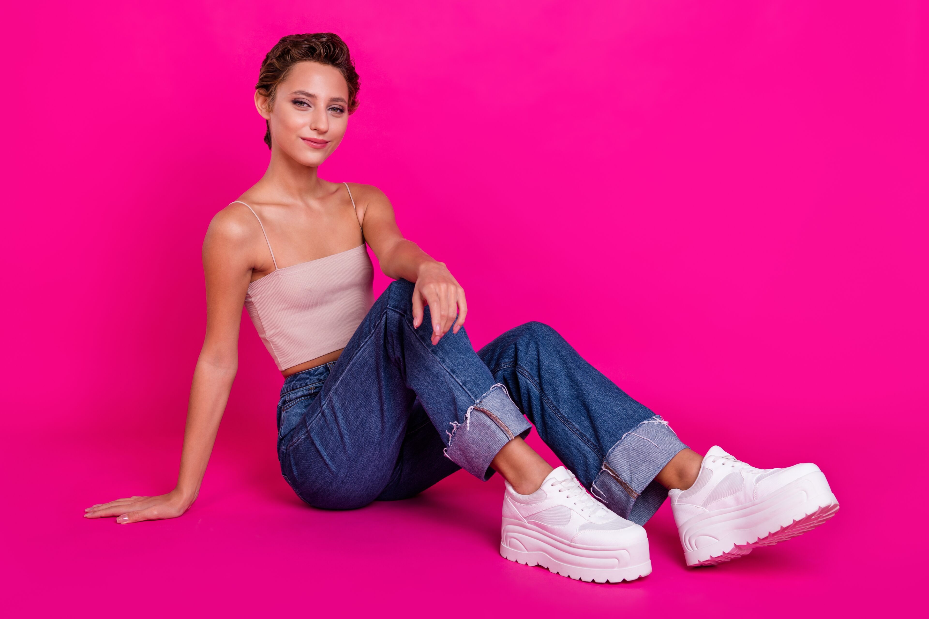 White Platform Shoes, Wide-Leg Jeans, And Halter Tops