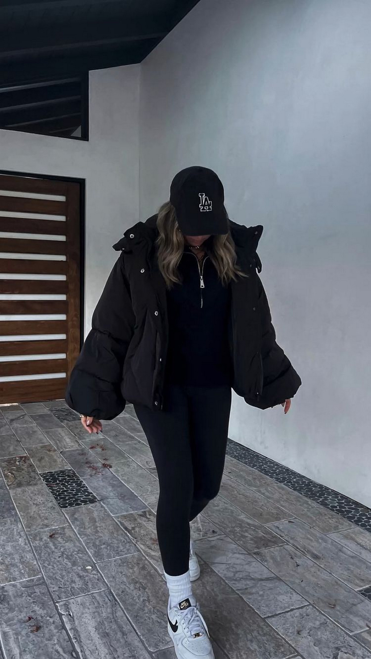 Black Outfits with a Down Jacket and Sneakers