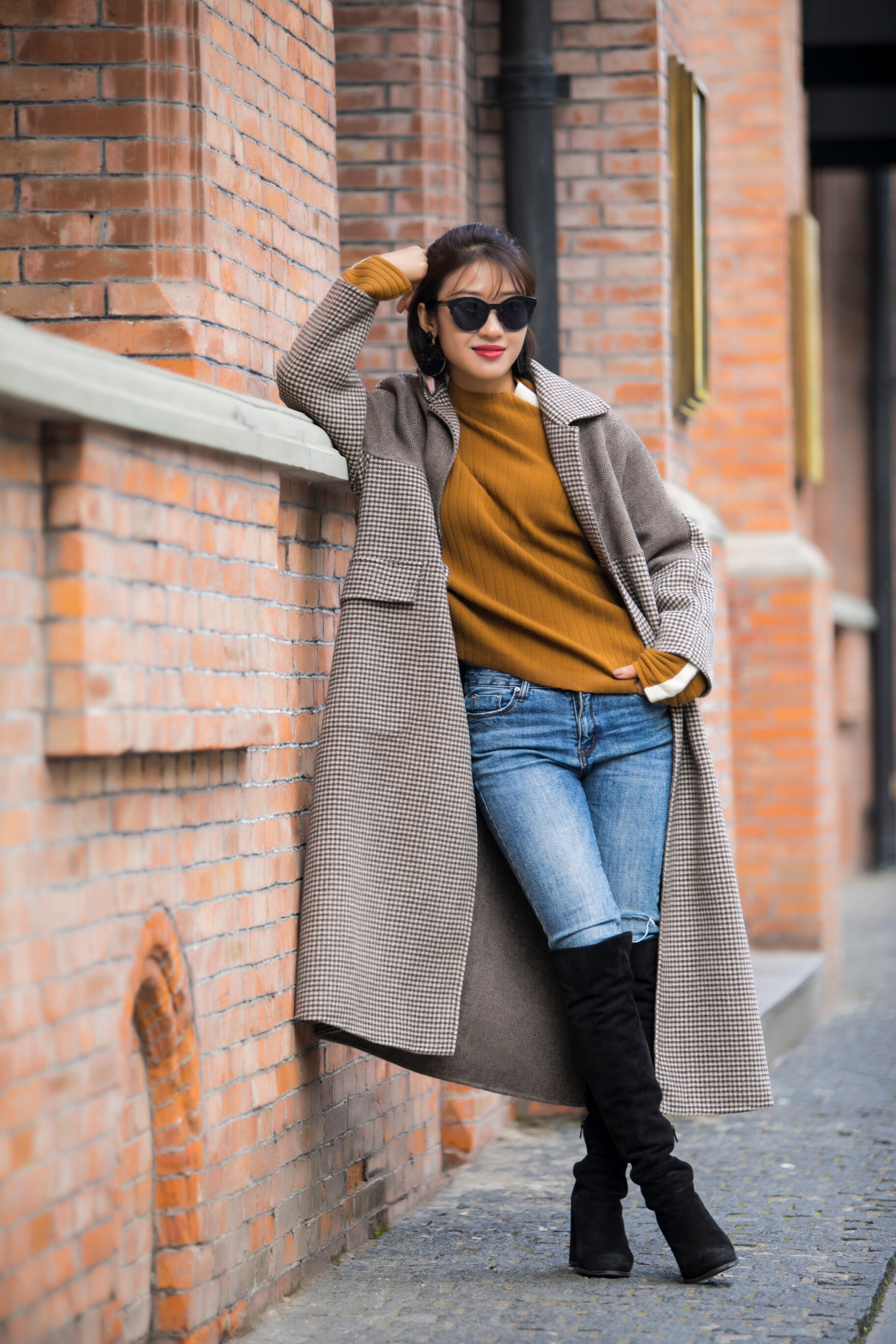 Beige Coat, Turtleneck Sweater, Skinny Jeans, And High-Knee Boots