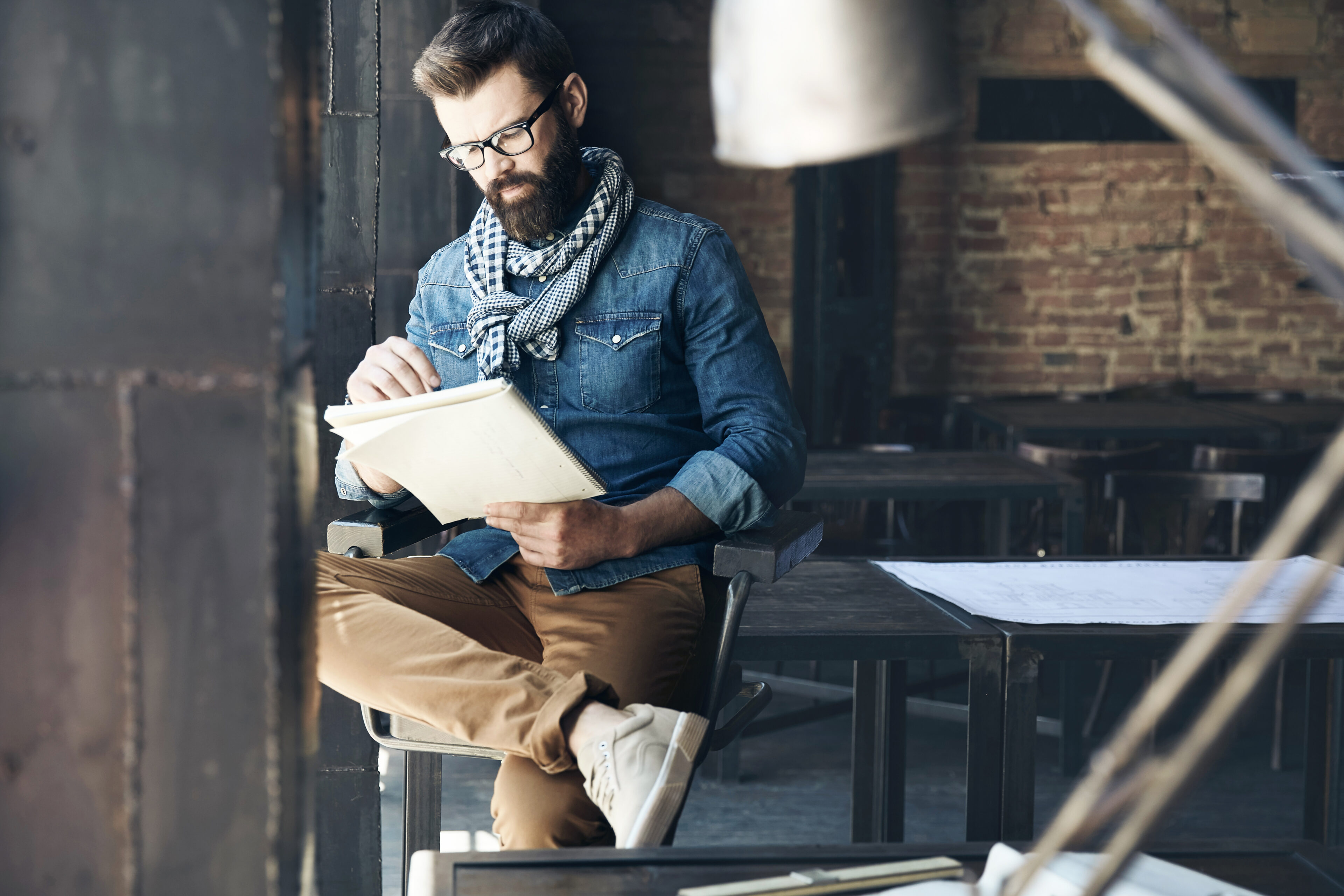 Black And White Striped Scarf, Glasses, Denim Jacket, And Brown Pants