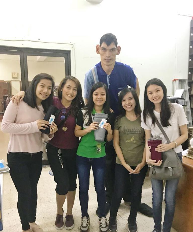 William Biscocho (the only man in the picture) is known as the tallest man in the Philippines. Photo taken from Facebook by IMPAC.
