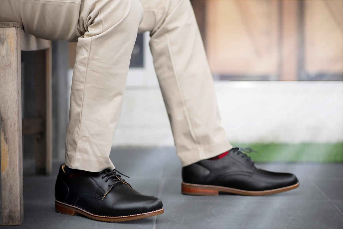 Wearing a white shirt striped grey pants and brown loafers