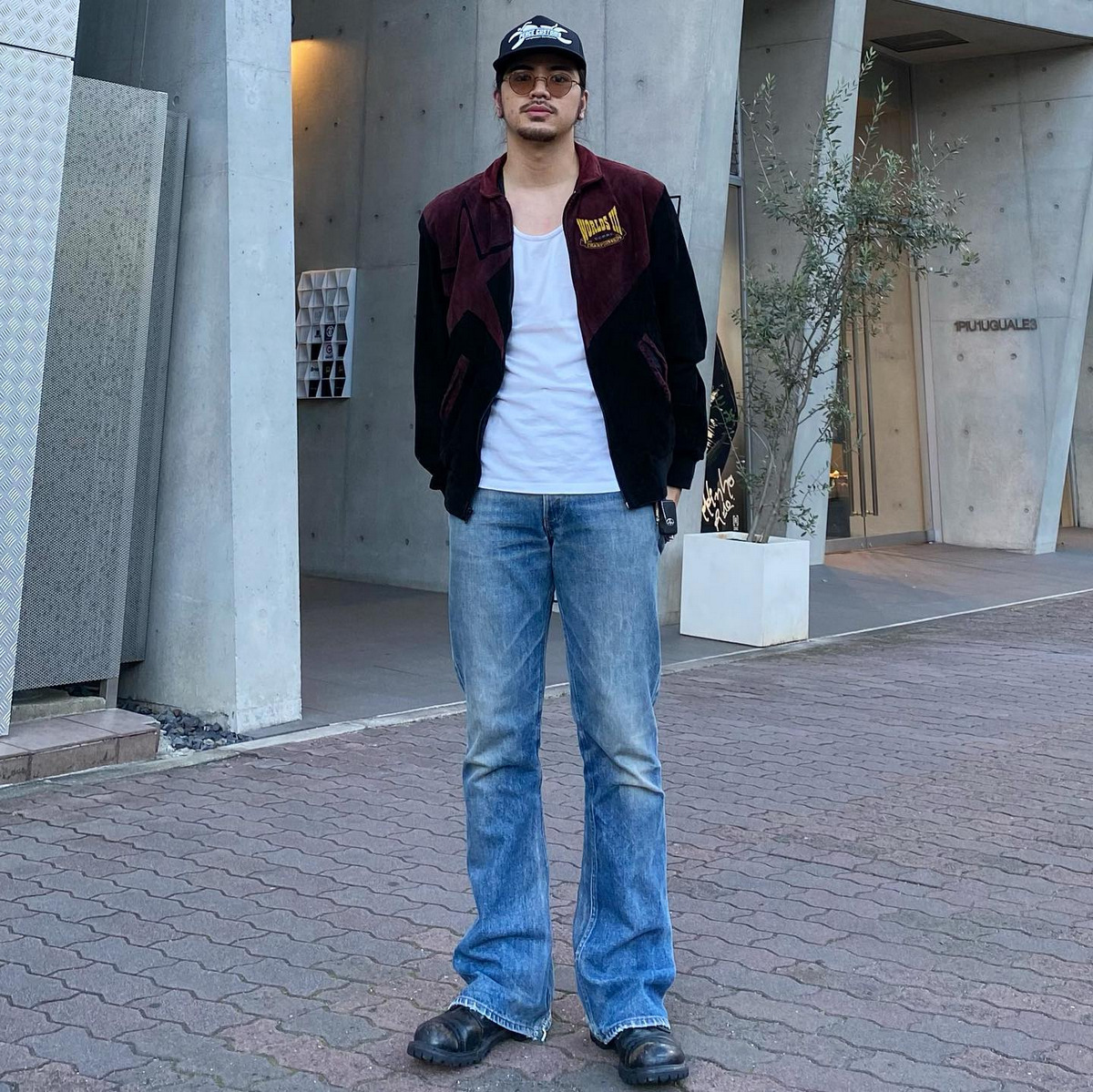 Black Snapback, Leather Biker Jacket with White T-Shirt