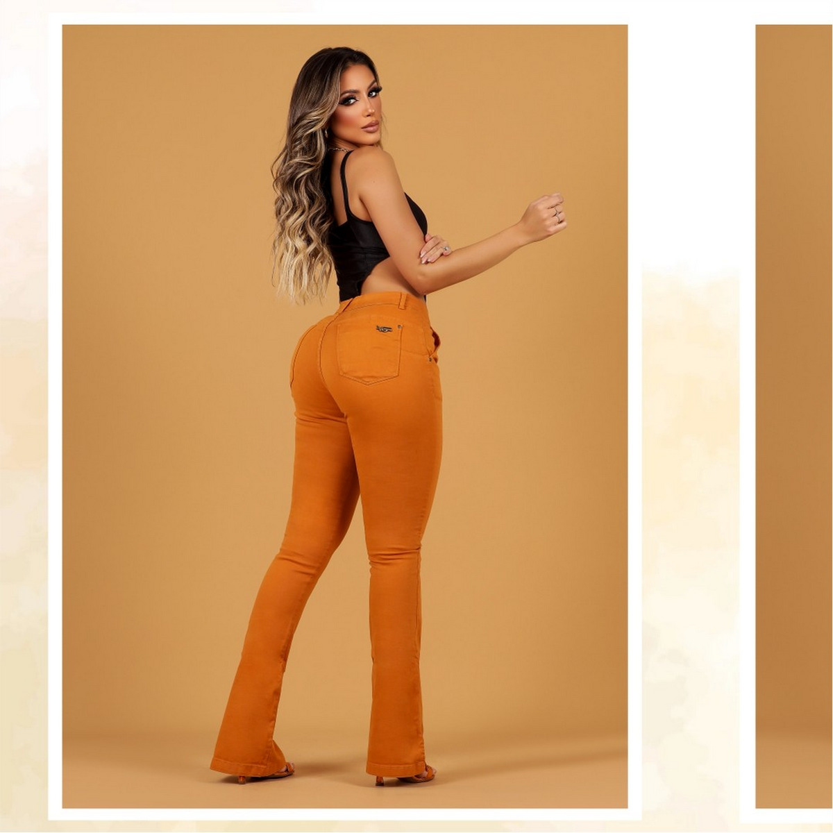 Black Sleeveless Bodysuit, Orange Flare Jeans, and Orange High Heels