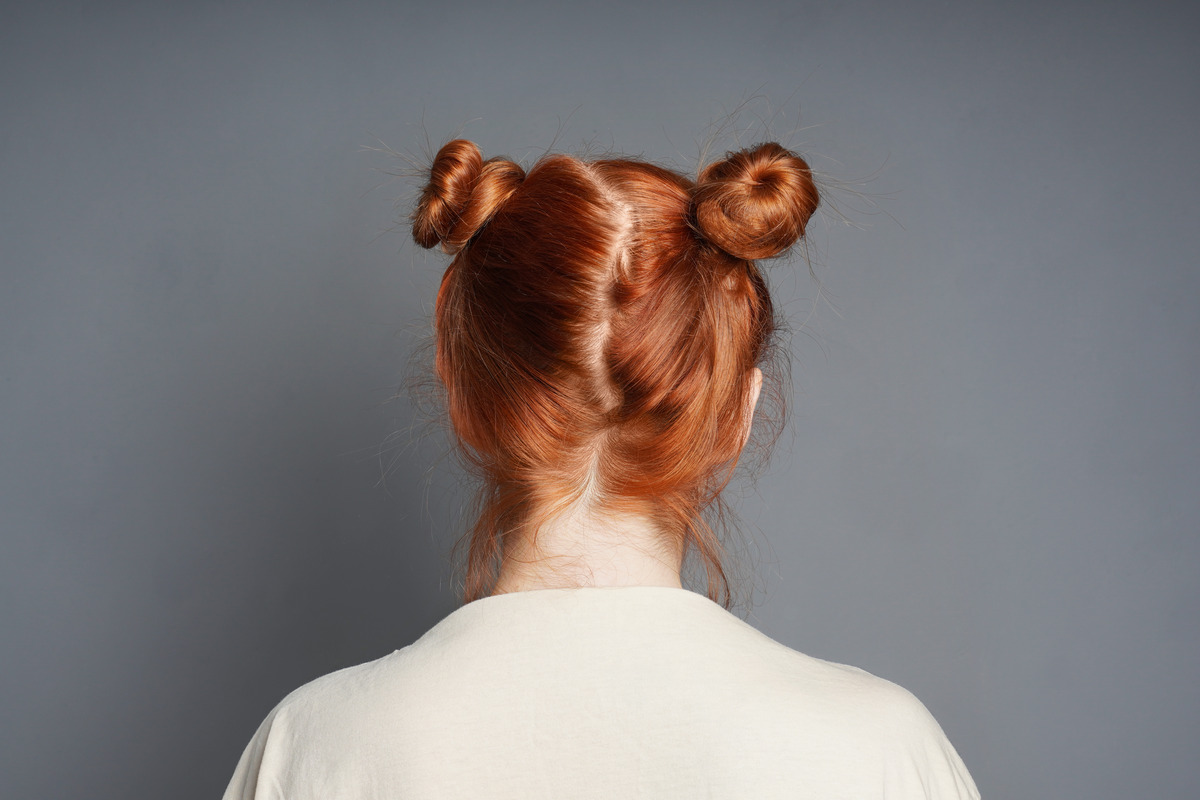 Red- Orange With Space Buns Hairstyle