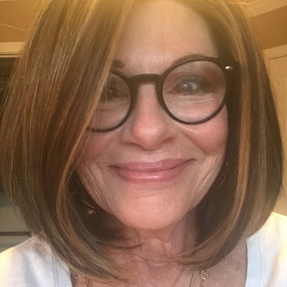 Sleek Lob With Eyebrow-Skimming Bangs