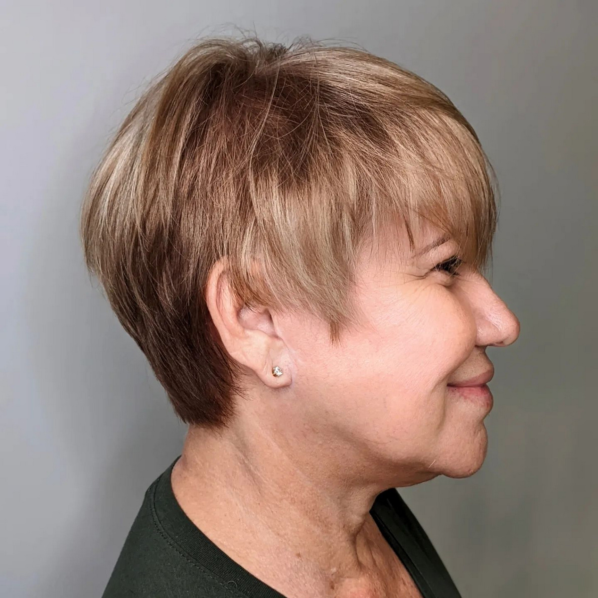 Highlighted Brown Hairstyle With Bangs