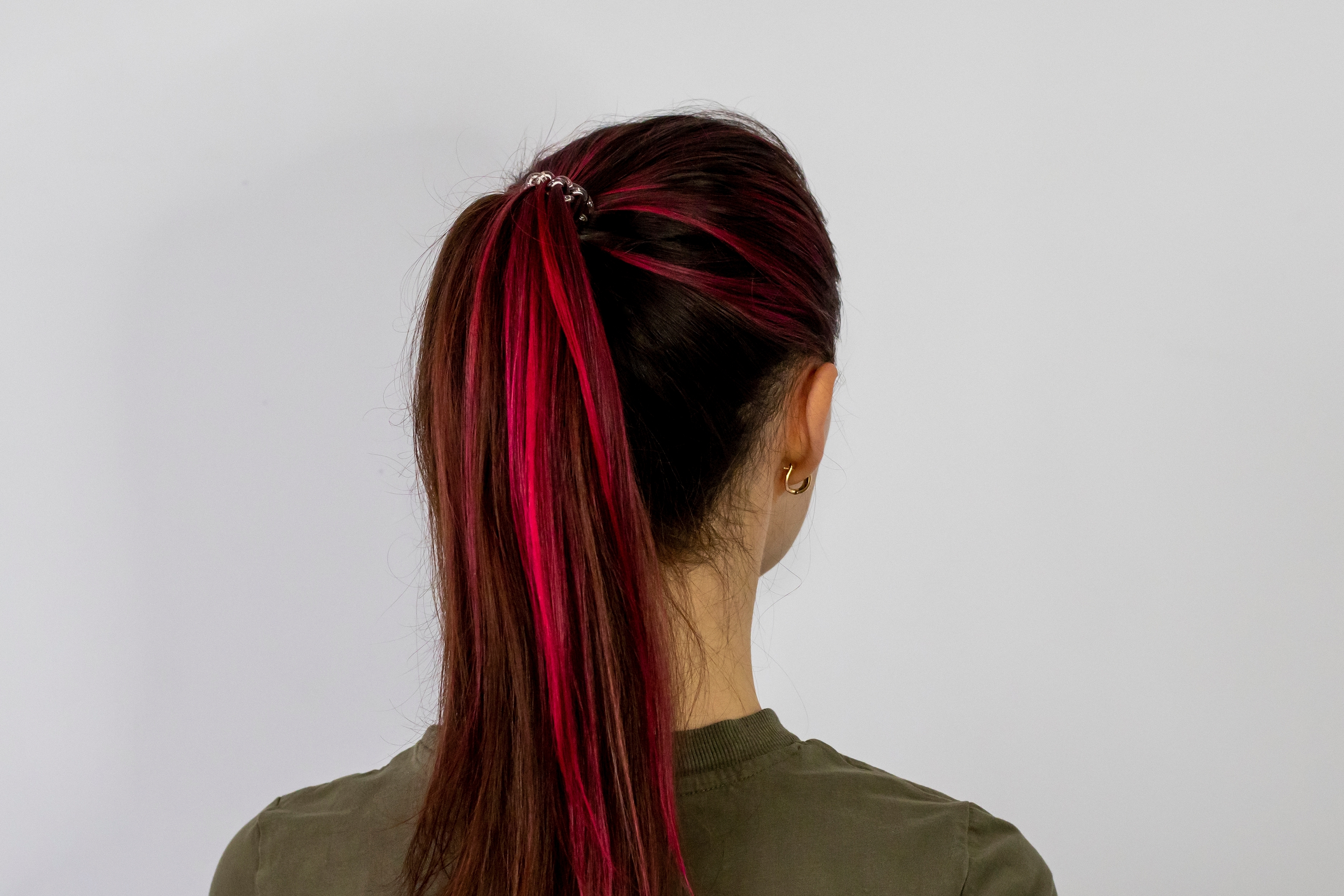 Burgundy Highlights On Black Hair With Ponytail