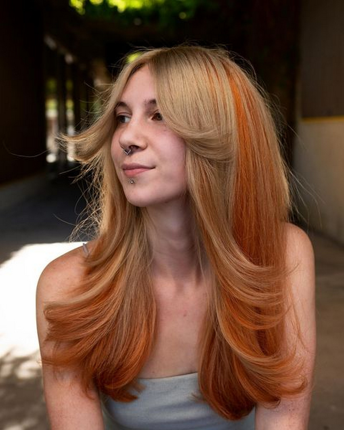 Ombre Orange And Ginger Hair With A Layer Of Bangs