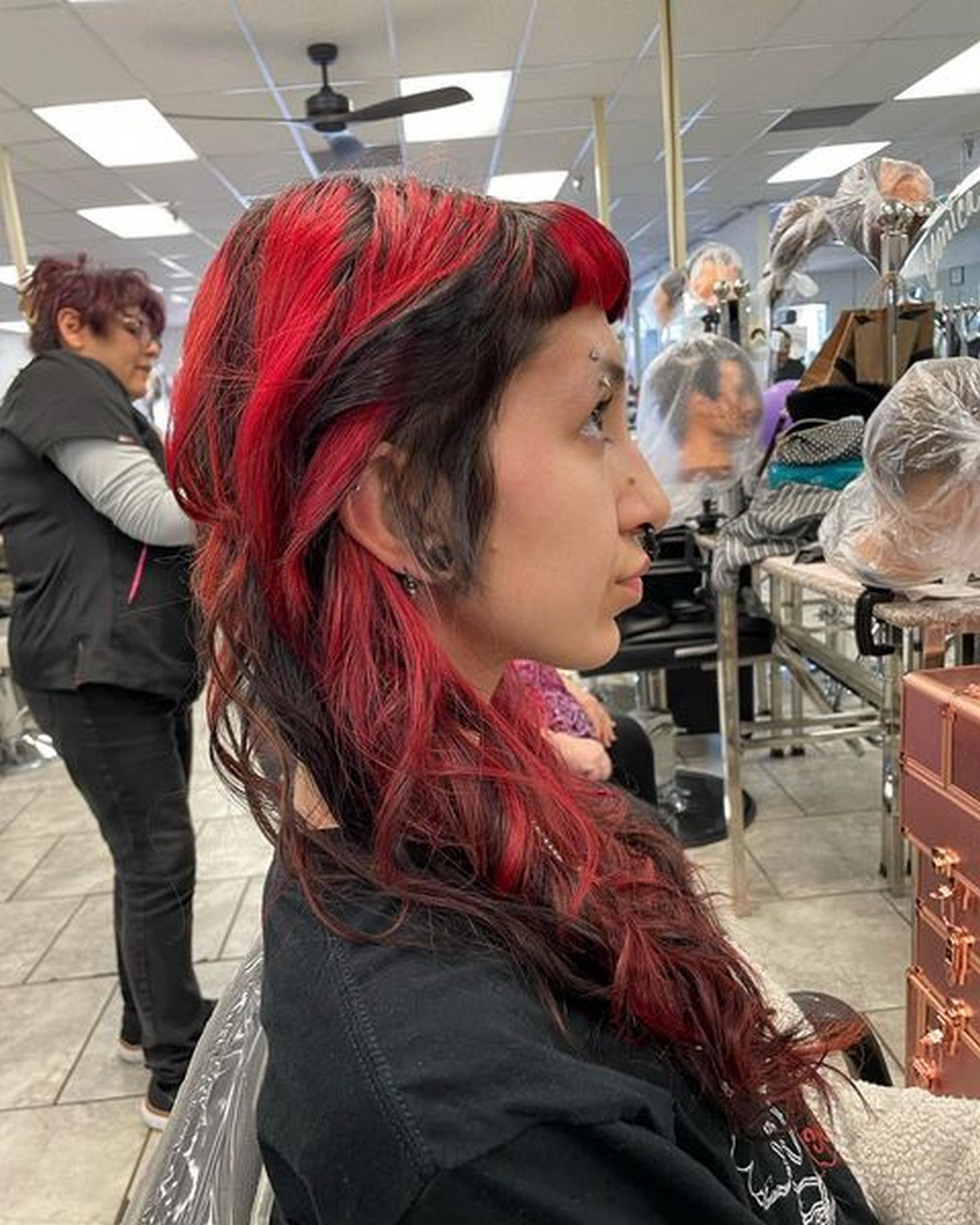 Punk Black Hairstyle With Bold Red Highlights