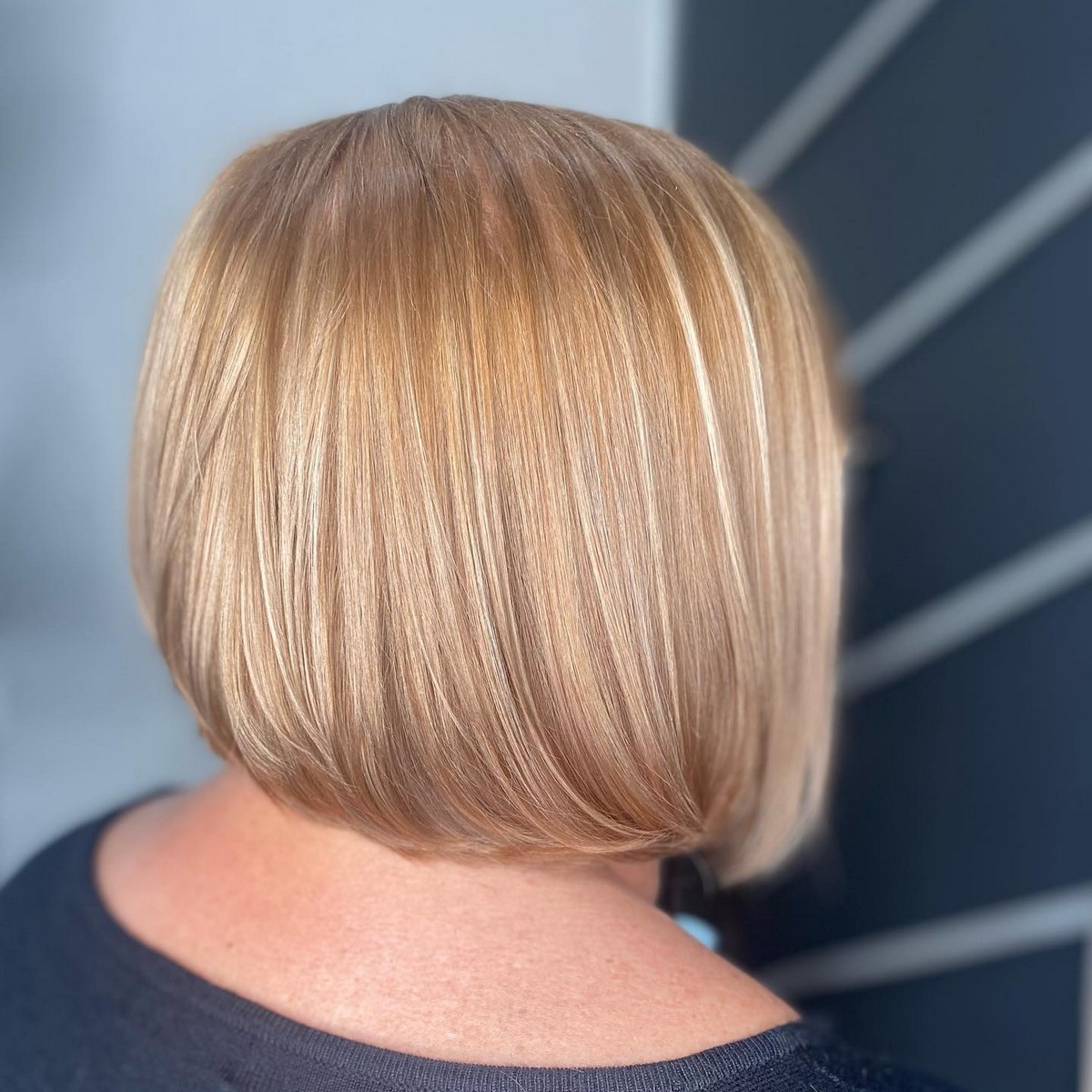 Sandy Blonde Highlights On Bob-Length Hair