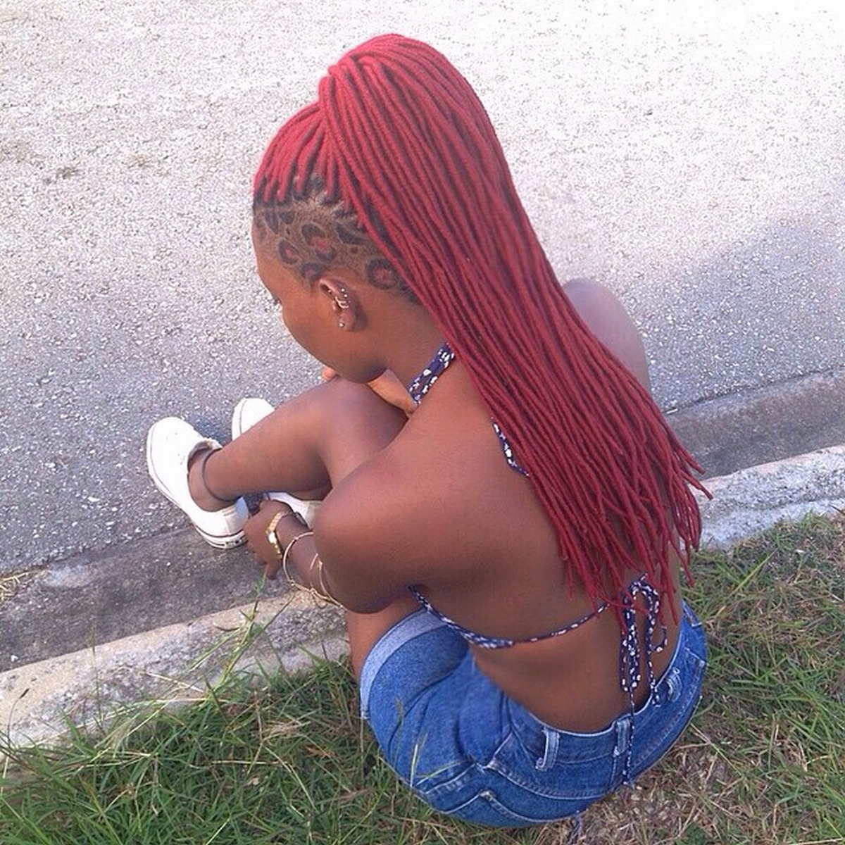 Red Ponytail Braid With Texture Shaved Side