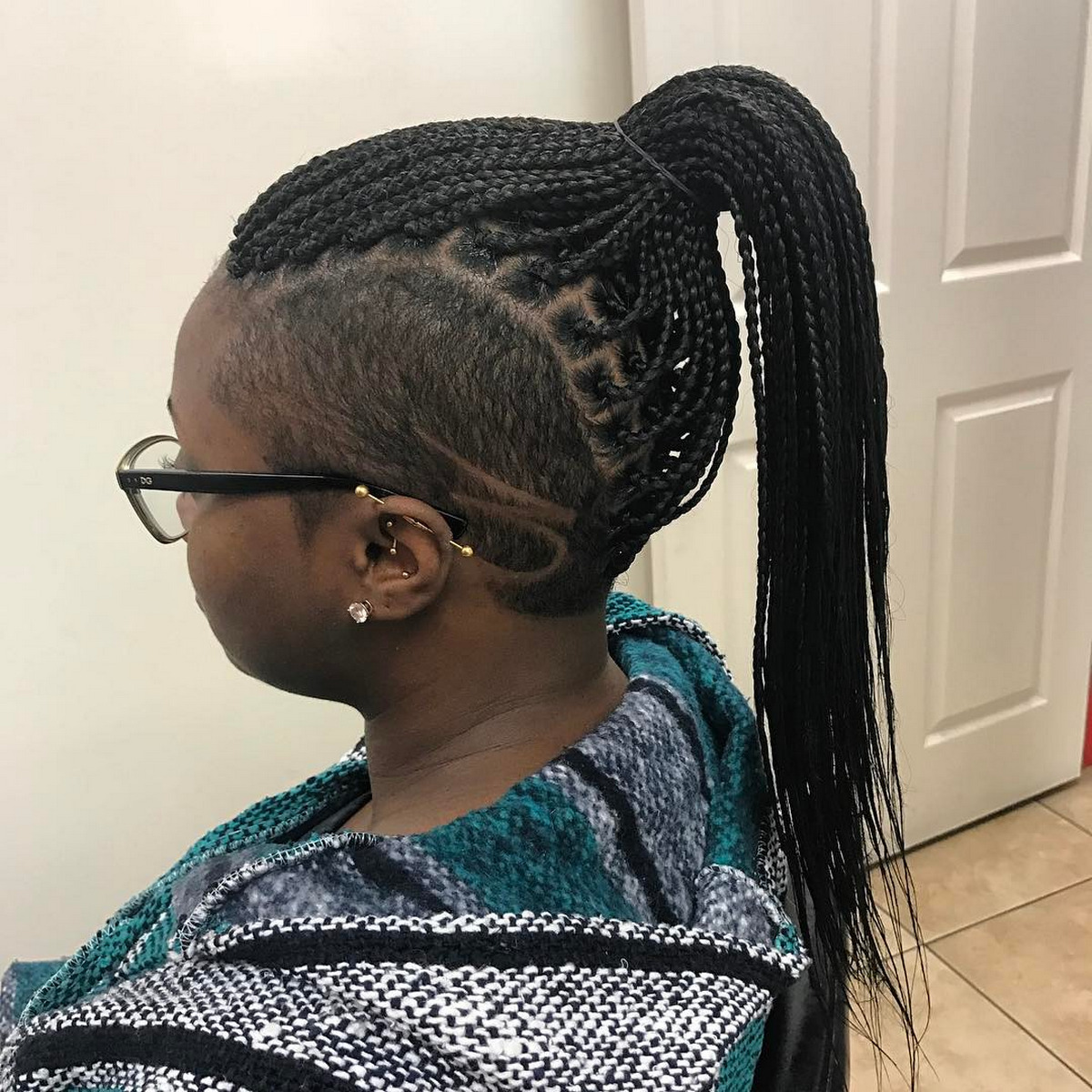 Braids In A Ponytail And Carved Sides