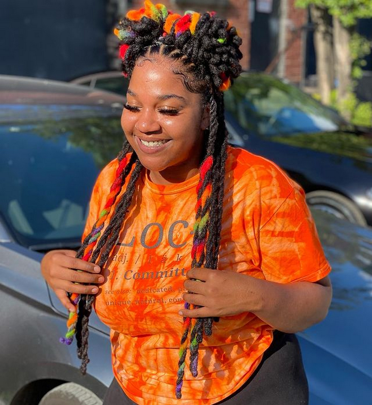 Long, Colorful Dreadlock With Two Buns