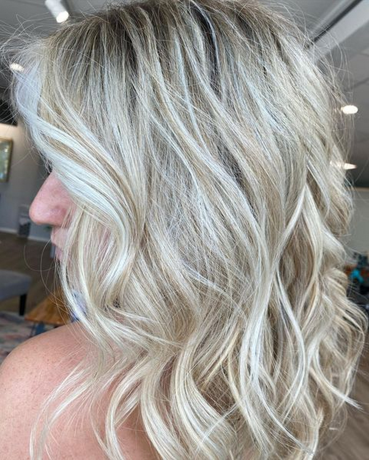 Platinum Blonde With Golden Honey Highlights And Dark Roots On Short Layered
