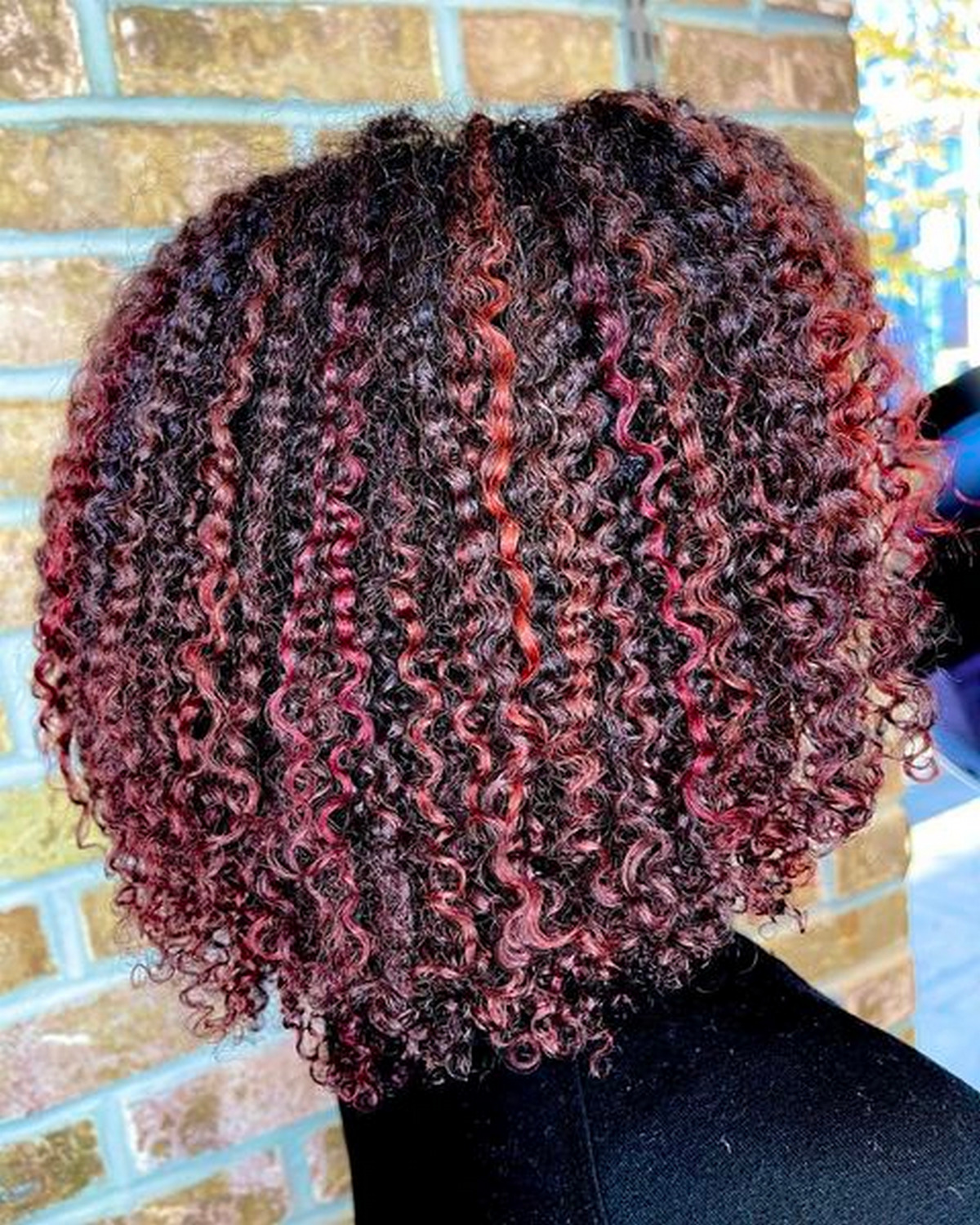 Curly Black Hair With Red And Copper Highlights