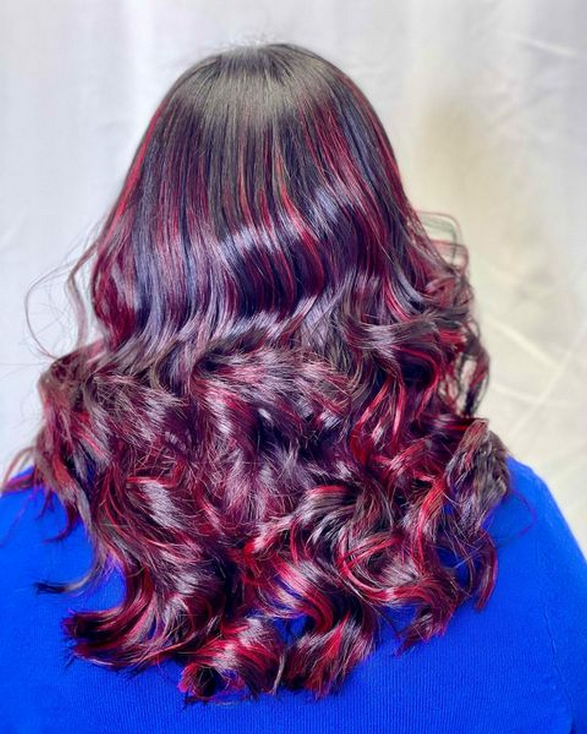Black Hair With Red Violet Balayage 