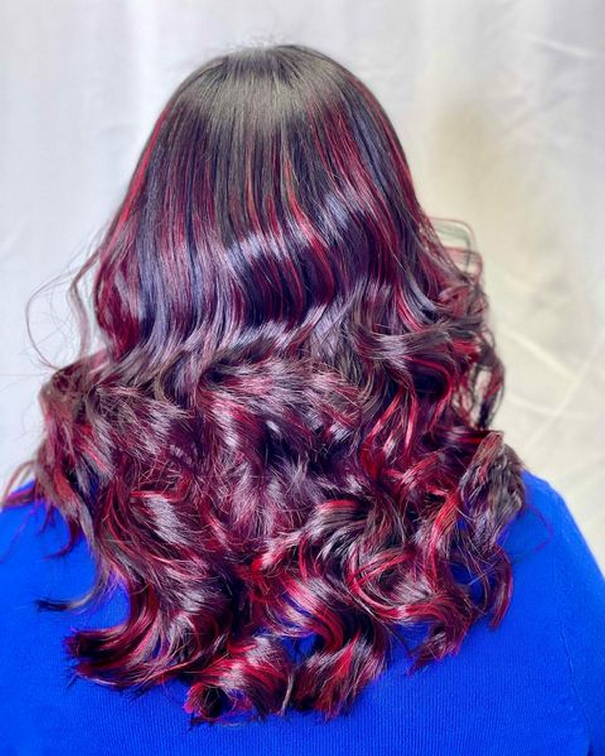 Black Hair With Red Violet Balayage