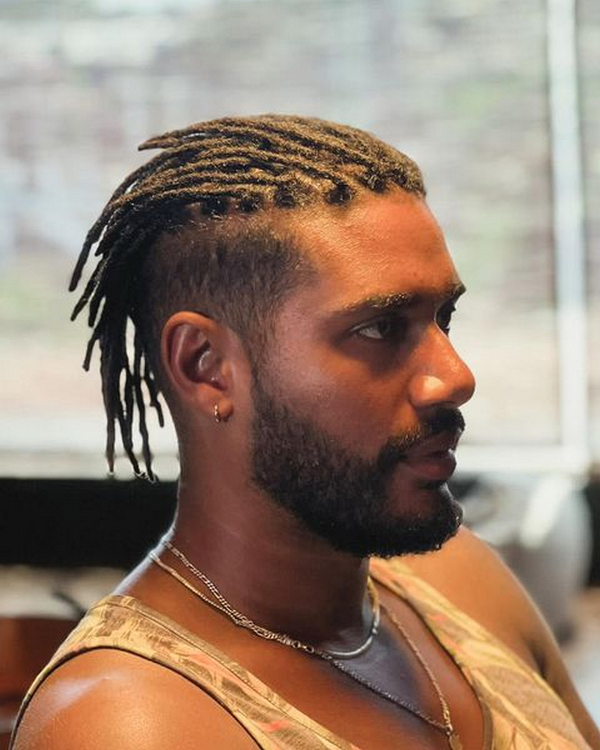 Half Shaved Hairstyle With Short Dreads